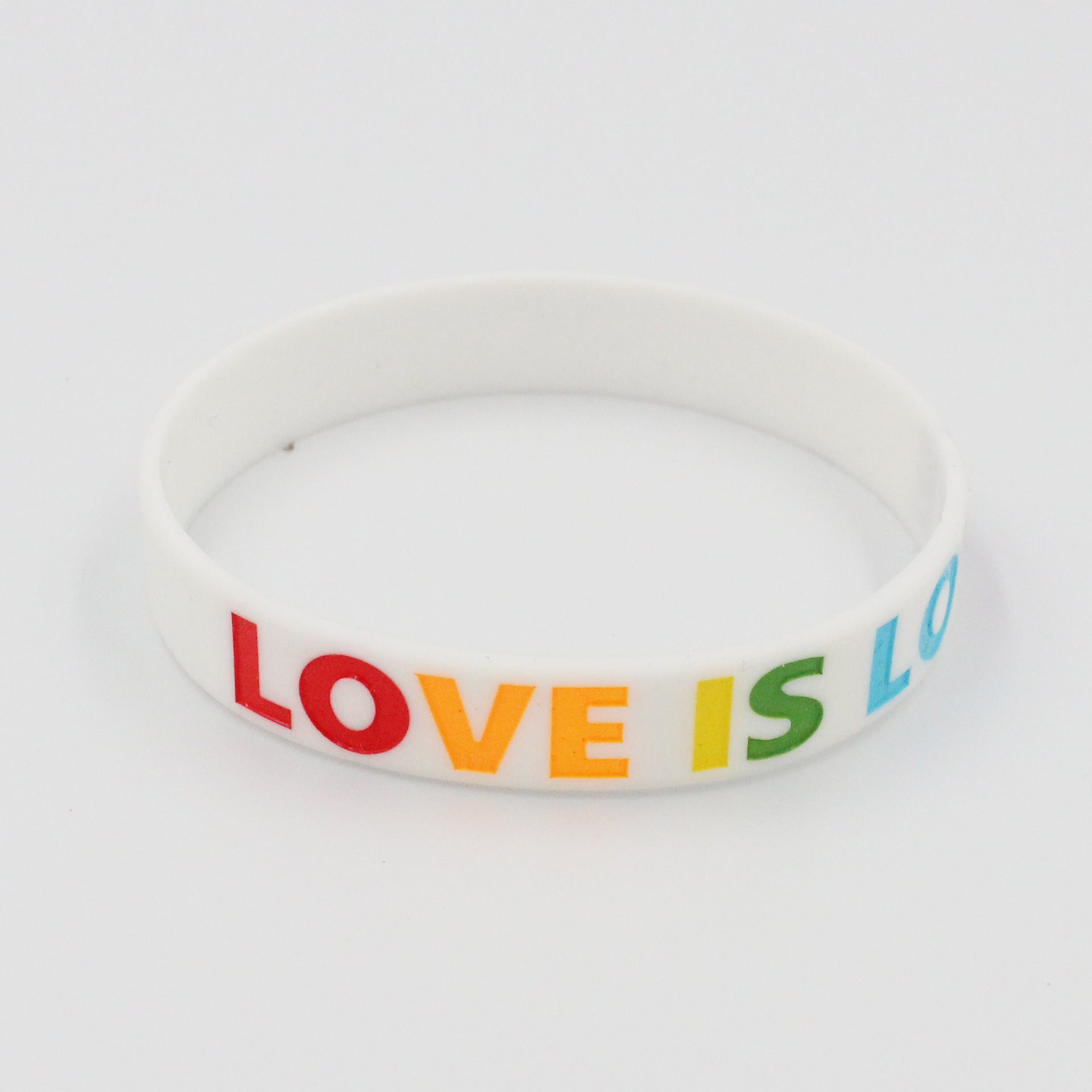 Silicona al por mayor Colores del arco iris amor es la brazalete de las parejas de amor